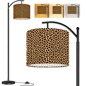 May include: A black metal floor lamp with an arched arm and a cylindrical lampshade featuring a brown and black leopard print pattern. The lamp is shown with three different light temperature settings, ranging from warm yellow to cool white light.
