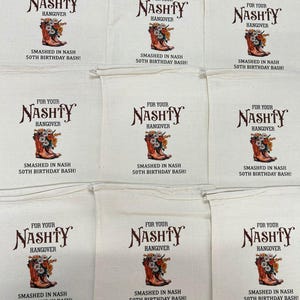 May include: Off-white canvas bags with a brown and orange design. The text reads "FOR YOUR NASHTY HANGOVER" above a cowboy boot filled with flowers. Below the boot, it says "SMASHED IN NASH 50TH BIRTHDAY BASH!"