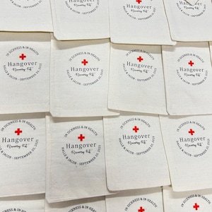 May include: Off-white fabric pouches with a circular design featuring the words "In Sickness & In Health" and "Hangover Recovery Kit." A red cross is centered above the text. The names "Halle & Jacob" and the date "September 20, 2025" are also included.