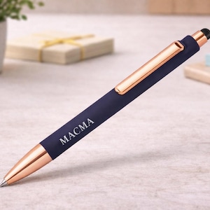 May include: A navy blue pen with rose gold detailing, featuring the word "MACMA" on the barrel. The pen has a stylus tip and a modern design. Ideal for writing or use with touchscreens.