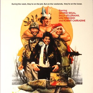 May include: Movie poster for the film "All's Fair" starring George Segal, Sally Kellerman, Lou Ferrigno, and Robert Carradine. The poster features a colorful illustration of the actors in a jungle setting. The text "All's Fair" is in large, bold letters at the bottom of the poster.