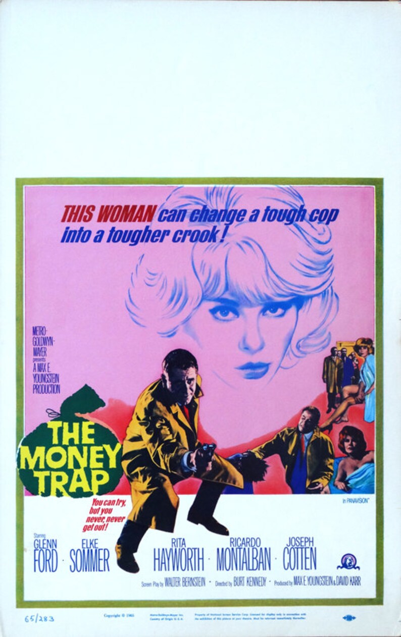 May include: A movie poster for the film "The Money Trap" starring Glenn Ford, Elke Sommer, Rita Hayworth, Ricardo Montalban, and Joseph Cotten. The poster features a woman with blonde hair and a pink background. The text "This woman can change a tough cop into a tougher crook!" is written in bold, red letters.