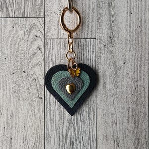 Real cowhide leather heart bag charm purse charm. Multicolored Blue. Yellow butterfly charm