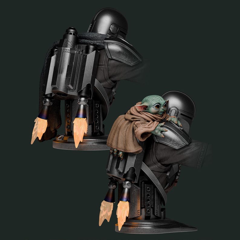 May include: A black Mandalorian bust with a jetpack, holding a green-skinned Grogu figure. The jetpack has orange flame effects. The figures are on a dark gray base, with a dark green background.
