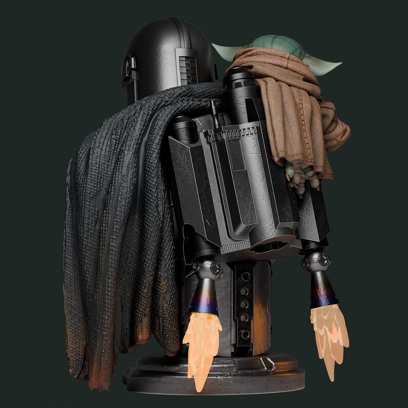 May include: A detailed statue of The Mandalorian with Grogu. The Mandalorian is in a black helmet and armor, with a dark cape. Grogu is wrapped in a brown blanket. The statue has a jetpack with orange flame effects.