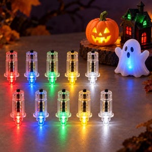 May include: Ten small, clear cylindrical LED lights arranged in two rows, each emitting a distinct red, blue, green, yellow, or white glow. In the background, a glowing orange jack-o'-lantern, a miniature haunted house, and a white ghost.