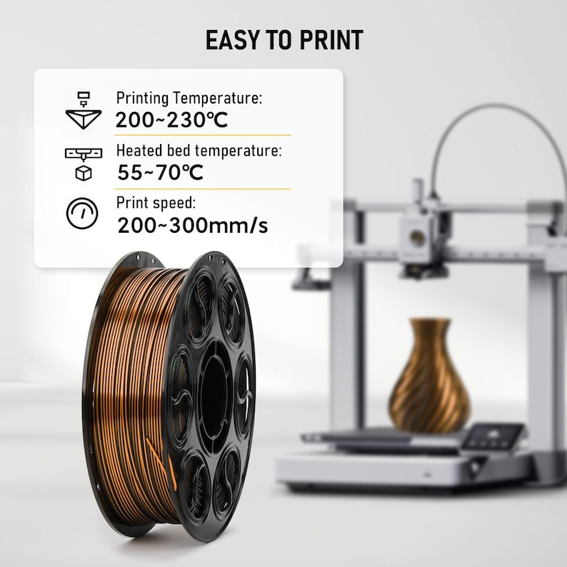 May include: A spool of metallic copper 3D printer filament with a black plastic core. An information box displays: EASY TO PRINT, Printing Temperature: 200~230&deg;C, Heated bed temperature: 55~70&deg;C, and Print speed: 200~300mm/s. A 3D printer is in the background.
