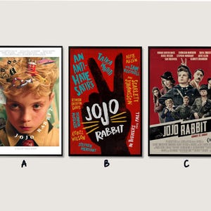 May include: Three framed movie posters for the film "Jojo Rabbit". The posters feature the film's title and imagery, including a young boy, a peace sign, and a cast of characters. The posters are in black frames.