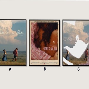 May include: Three framed movie posters for "Bones & All". The first poster features two figures in a field under a cloudy sky with the title. The second poster has a close-up of two faces. The third poster shows the title and two figures.