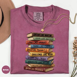 Comfort Colors brick shirt featuring stacked books with inspirational Black leader quotes graphic, garment dyed soft cotton unisex t-shirt