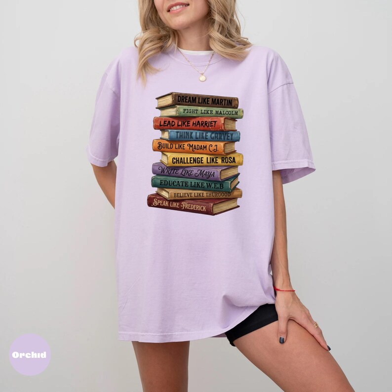 Comfort Colors orchid shirt featuring stacked books with inspirational Black leader quotes graphic, garment dyed soft cotton unisex t-shirt