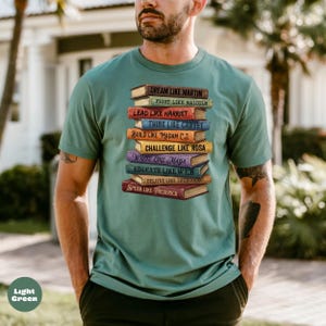 Comfort Colors light green shirt featuring stacked books with inspirational Black leader quotes graphic, garment dyed soft cotton unisex t-shirt