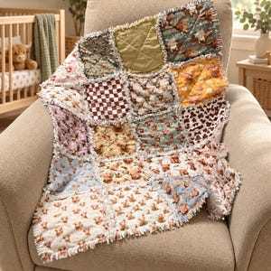 May include: A patchwork rag quilt featuring various fabric squares with patterns of highland cattle, brown and white checkered prints, and solid olive green. The quilt has exposed frayed seams between each square, creating a textured, layered appearance.