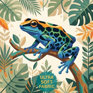 May include: A colorful illustration of a frog perched on a branch, surrounded by tropical foliage. The frog features blue, green, and orange patterns. The text "ULTRA SOFT FABRIC" is displayed on a green badge.