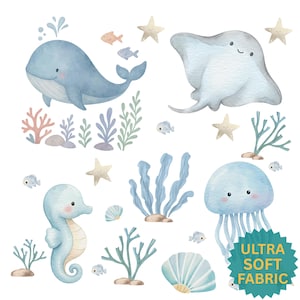 May include: Watercolor illustration of various sea creatures, including a whale, stingray, seahorse, and jellyfish, along with starfish, fish, and coral. The image has a soft, pastel color palette and includes the text "ULTRA SOFT FABRIC".