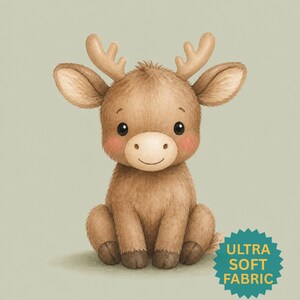 May include: A brown, furry cartoon reindeer with large ears, small antlers, and pink cheeks, sitting in a forward-facing position. A teal, star-shaped badge in the bottom right corner features the yellow text, ULTRA SOFT FABRIC.