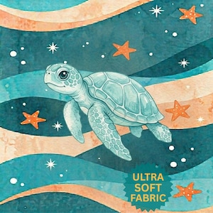May include: Watercolor illustration of a sea turtle swimming in an ocean scene. The turtle is light blue, surrounded by orange starfish and white stars. The background features blue and tan wavy stripes. Text reads "ULTRA SOFT FABRIC."
