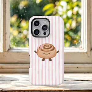 May include: A phone case featuring a light pink and white vertical striped pattern. Centered on the case is a cartoon illustration of a brown cinnamon roll with a small pink bow, tiny arms, and legs, and a simple smiling face.