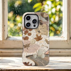 May include: A smartphone case featuring a collage of vintage-style elements including brown autumn leaves, two cinema tickets, a dragonfly, a skeleton key, a stack of books, and a white teapot set, all layered over a background of cursive script.