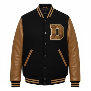 May include: Black varsity jacket with brown leather sleeves and a brown letter "D" patch. The jacket has a black body, a brown collar, and brown and gold striped cuffs and hem. The jacket has a button-up front.