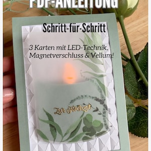 Op de afbeelding: Handgemaakte wenskaart met een LED-kaarseffect. De kaart heeft de tekst "Zur Hochzeit" in gouden script, met een groen en wit bloemmotief. De kaart is omlijst door een lichtgroene rand.