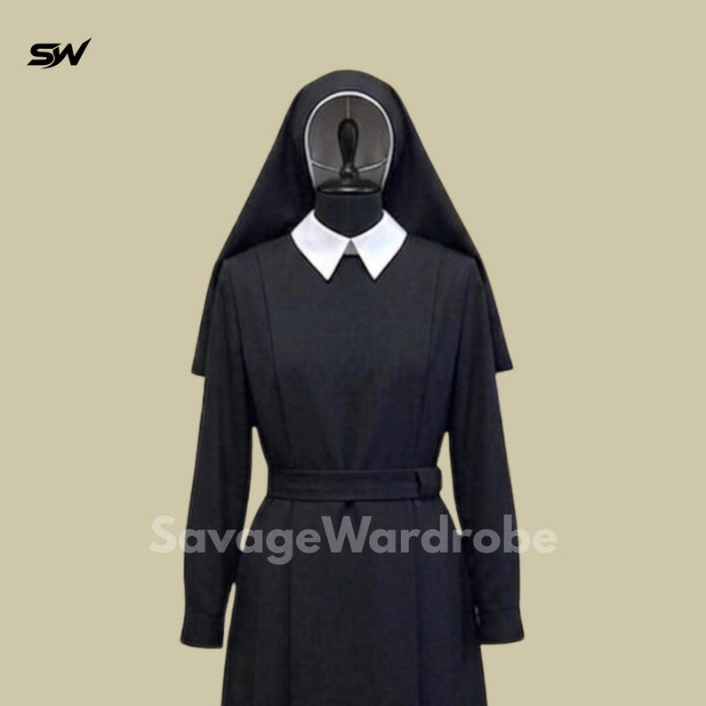 May include: A black nun habit with a white collar and a matching belt. The habit includes a long-sleeved dress and a head covering. The text "SavageWardrobe" is visible on the garment.