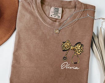 Comfort Colors® Custom Leopard Nurse Shirt, Stethoscope Bow Tee, Coquette Nurse Shirt, Nurse Gift, Nurse Shirt, Nursing School Tee, RN Shirt