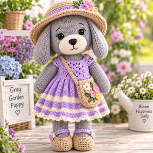 May include: A gray knitted puppy doll wearing a straw hat with small flowers, a purple and white striped dress, and tan shoes with flower accents. The doll carries a small tan crossbody bag decorated with a cluster of colorful fabric flowers.