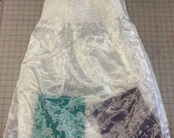 Smocked sheer bridal or flower girl fabric. Glitter and floral