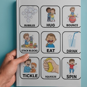 May include: A white ceramic mug with a black handle and the text "But First, Coffee" in a bold, black font. The mug is set against a blurred background, suggesting a cozy setting.