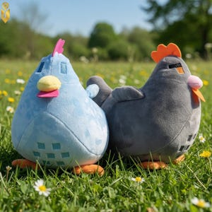 May include: Two plush chicken toys in a grassy field. One is light blue with a pink comb and yellow beak, the other is gray with an orange comb and pink beak. Both have orange feet.