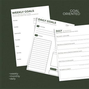 May include: Three white paper planning sheets with black text. One sheet is titled Weekly Goals, another Daily Goals with Top 3 Priorities, and the third is a July Mid-Year Refocus sheet with prompts for monthly goals, focus, and intentions.