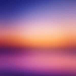 May include: Abstract gradient background with a color palette of purple, orange, and blue. The colors blend smoothly, creating a soft, blurred effect. The image is a vertical composition, with the colors transitioning from dark purple at the bottom to blue at the top.