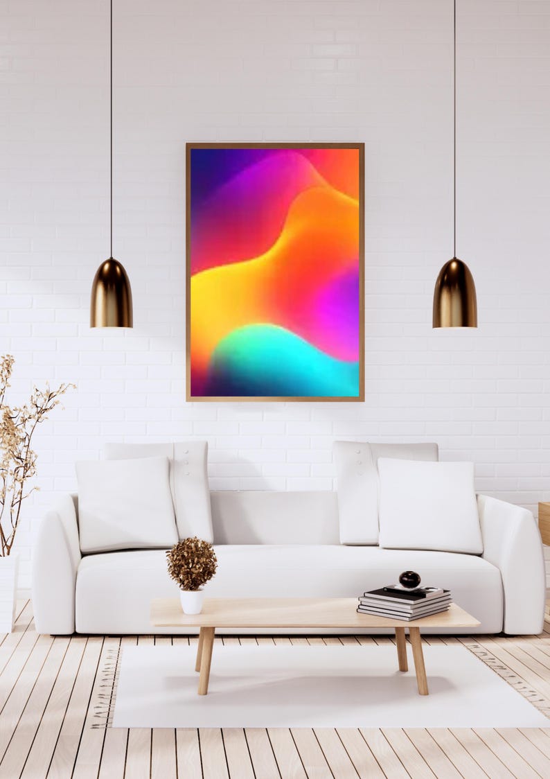 May include: A framed abstract art print with a vibrant, colorful design. The artwork features a gradient of colors, including purple, orange, yellow, and teal. The print is displayed in a modern living room setting with a white sofa and wooden coffee table.