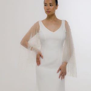 Plus size Wedding mermaid dress with open back and pearl sheer sleeves.
