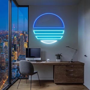 May include: A circular neon wall sign featuring a stylized sunset design with a solid blue top arc and three horizontal light blue bars of varying lengths below it, mounted on a gray wall above a wooden desk in a modern office space.