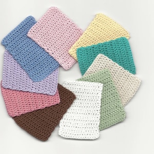 May include: A collection of ten crocheted squares in various colors, including pink, blue, green, brown, and white. The squares are arranged in a circle.