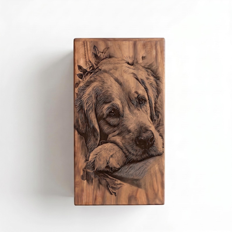 May include: A rectangular wooden plaque featuring a detailed, dark brown laser-engraved portrait of a golden retriever dog. The dog is depicted with its head resting on its paw, surrounded by subtle leaf accents, set against a natural wood grain.