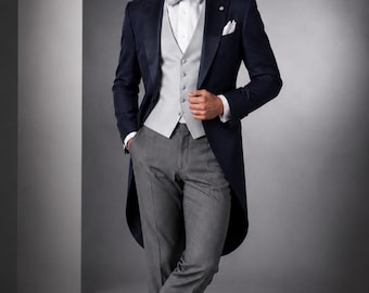 May include: A formal navy blue tuxedo with a gray vest, bow tie, and trousers. The tuxedo features a long tailcoat design. The outfit is completed with a white dress shirt and black dress shoes. A pocket square is visible.