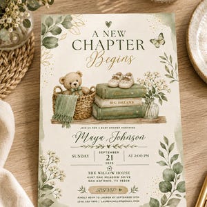 May include: A rectangular baby shower invitation card featuring a teddy bear in a woven basket, a stack of three green books topped with baby shoes, and a vase of flowers. The text reads A NEW CHAPTER BEGINS, Maya Johnson, September 21, 2025, and The Willow House.
