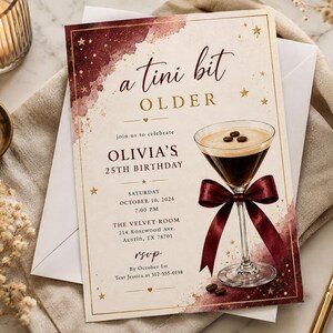 May include: A rectangular birthday invitation card featuring a watercolor design in deep burgundy and cream. The text reads a tini bit OLDER, Olivia's 25th Birthday, and event details. A martini glass with a burgundy ribbon and coffee beans is shown.