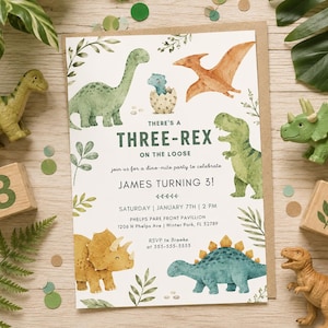 May include: A rectangular birthday invitation card featuring watercolor illustrations of various dinosaurs, green leaves, and the text: THERE'S A THREE-REX ON THE LOOSE, join us for a dino-mite party to celebrate, JAMES TURNING 3!, SATURDAY, JANUARY 7TH, 2 PM.