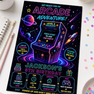 May include: A rectangular birthday invitation card featuring a neon-style arcade cabinet graphic against a dark space background with planets and rockets. Text includes "ARCADE ADVENTURE!", "JACKSON'S 5TH BIRTHDAY", and event details for October 24, 2026.