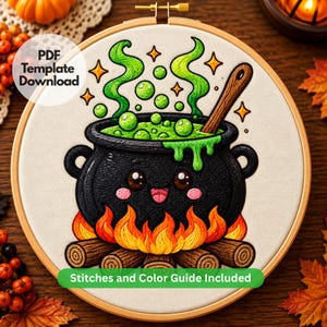 May include: An embroidery hoop containing a fabric piece with a stitched black cauldron over a fire. The cauldron has a smiling face, green bubbling liquid, and a wooden spoon. Text reads PDF Template Download and Stitches and Color Guide Included.