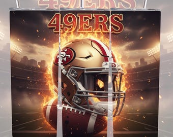 May include: A stainless steel tumbler featuring a football helmet and football with the text "49ERS" in red and gold. The design includes a stadium backdrop with flames and a dramatic sky.