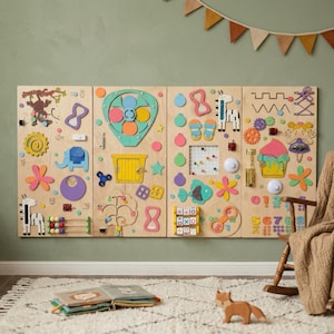 May include: A large wooden activity board for toddlers, featuring various interactive elements. Includes colorful shapes, gears, a spinning fan, a xylophone, and a tic-tac-toe game. The board is designed to stimulate sensory and fine motor skills.