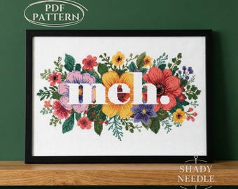 Satire cross stitch PDF pattern with MEH text. Subversive embroidery chart for instant download. Xstitch cheeky design on floral background
