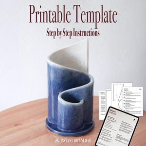 May include: A blue ceramic pen holder with a unique curved design, next to a tablet displaying printable templates and instructions. The text "Printable Template" and "Step by Step Instructions" are visible. The image also includes the text "Instant Download".