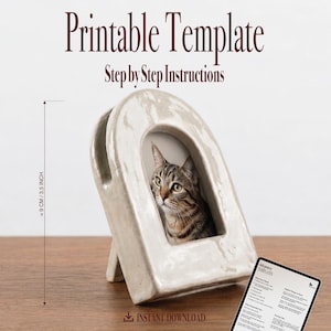 May include: A printable template for a ceramic arch-shaped frame measuring 3.5 inches in height. The frame features a distressed off-white finish and displays a photograph of a tabby cat. Includes a digital instruction sheet with step-by-step guides.