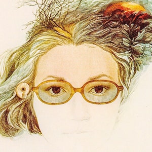 May include: A woman with blonde hair wearing round, gold-rimmed glasses. Her hair is styled with a floral and branch design.